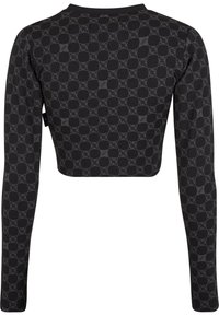 Fekete, hosszú ujjú crop top, tonális geometrikus mintával. Puha anyagból készült, fitted kialakítással és kerek nyakkal.