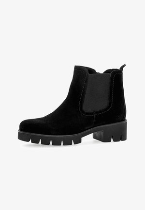 Black suede ankle boots with elastic side panels, rounded toe, and chunky rubber sole. Features stitching details and a pull tab at the back.