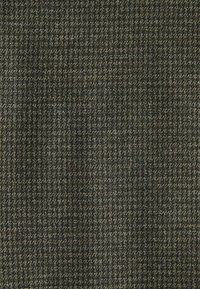 Textured fabric featuring a herringbone pattern, composed of dark gray and light brown threads with subtle variations and highlights.