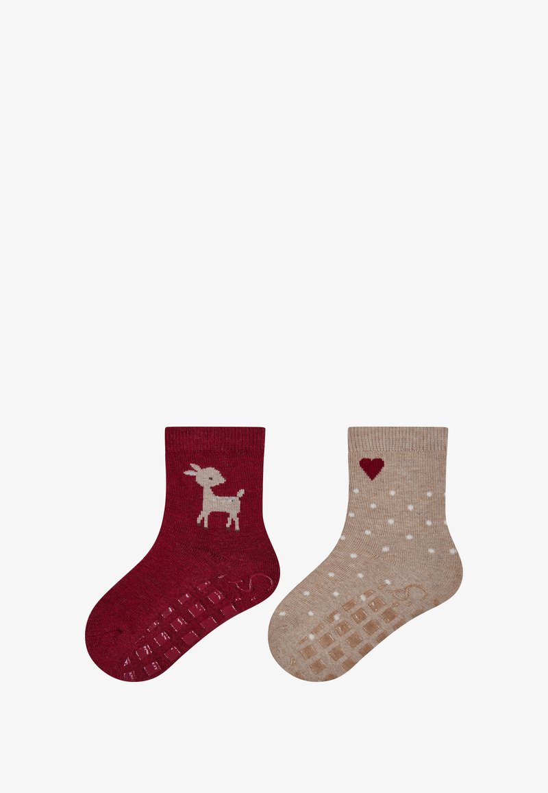 Rote Socke mit Ziegenmuster, strukturierte rutschfeste Unterseite; beige Socke mit weißen Punkten und Herzakzent, glattes Material, knielange Länge.