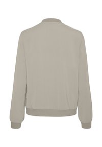 Light beige bomber jacket made from smooth fabric, featuring a ribbed collar and cuffs, with a relaxed fit and no visible patterns.