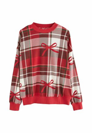 Rdeča in rjava dolg rokav sweatshirt s tartan vzorcem in dekorativnimi rdečimi pentljami. Ima rebrast izrez in manšete, izdelan je iz mehkega blaga.