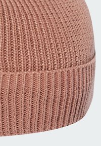 Pink knit beanie featuring a ribbed texture, with a snug fit and a soft fabric. The design includes a turned-up cuff for added warmth.