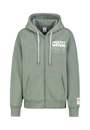Olive green zip-up hoodie in soft cotton. Features a drawstring hood, kangaroo pockets, and white graphic text on the front.