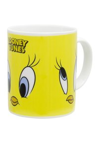 Tazza in ceramica con un brillante esterno giallo caratterizzato da facce di uccelli in stile cartone animato, contorni neri e il logo "Looney Tunes" in nero nella parte superiore.