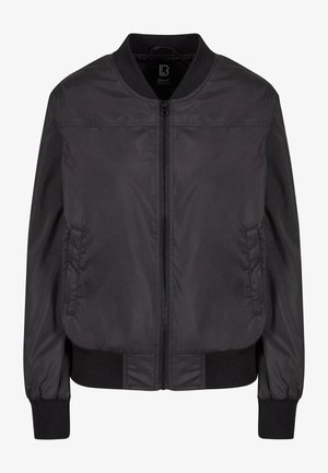 Zwarte bomberjack gemaakt van gladde stof, met een ritssluiting aan de voorkant, geribbelde manchetten en twee zijzakken. Minimalistisch ontwerp zonder patronen.