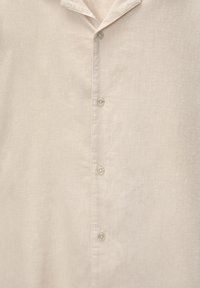 Ljusbeige knapp-up skjorta i mjukt tyg, med krage, sex knappar framtill och en slät textur.