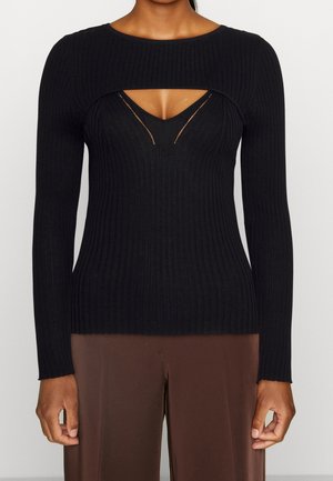 Haut noir à manches longues à côtes avec un design découpé au niveau du col. Fabriqué en tissu doux et texturé avec une silhouette ajustée.