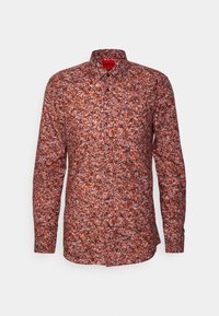 Camicia a maniche lunghe con un motivo floreale in tonalità di arancione e nero, con colletto a punta e bottoni neri. Realizzata in tessuto leggero.