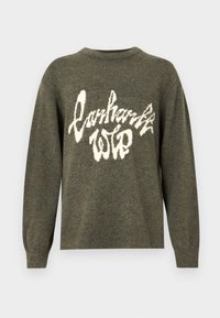 Olíva zöld kötött pulóver kerek nyakkal, elöl fehér grafikai nyomattal, amelyen a "Carhartt WIP" felirat hullámos betűtípussal szerepel.
