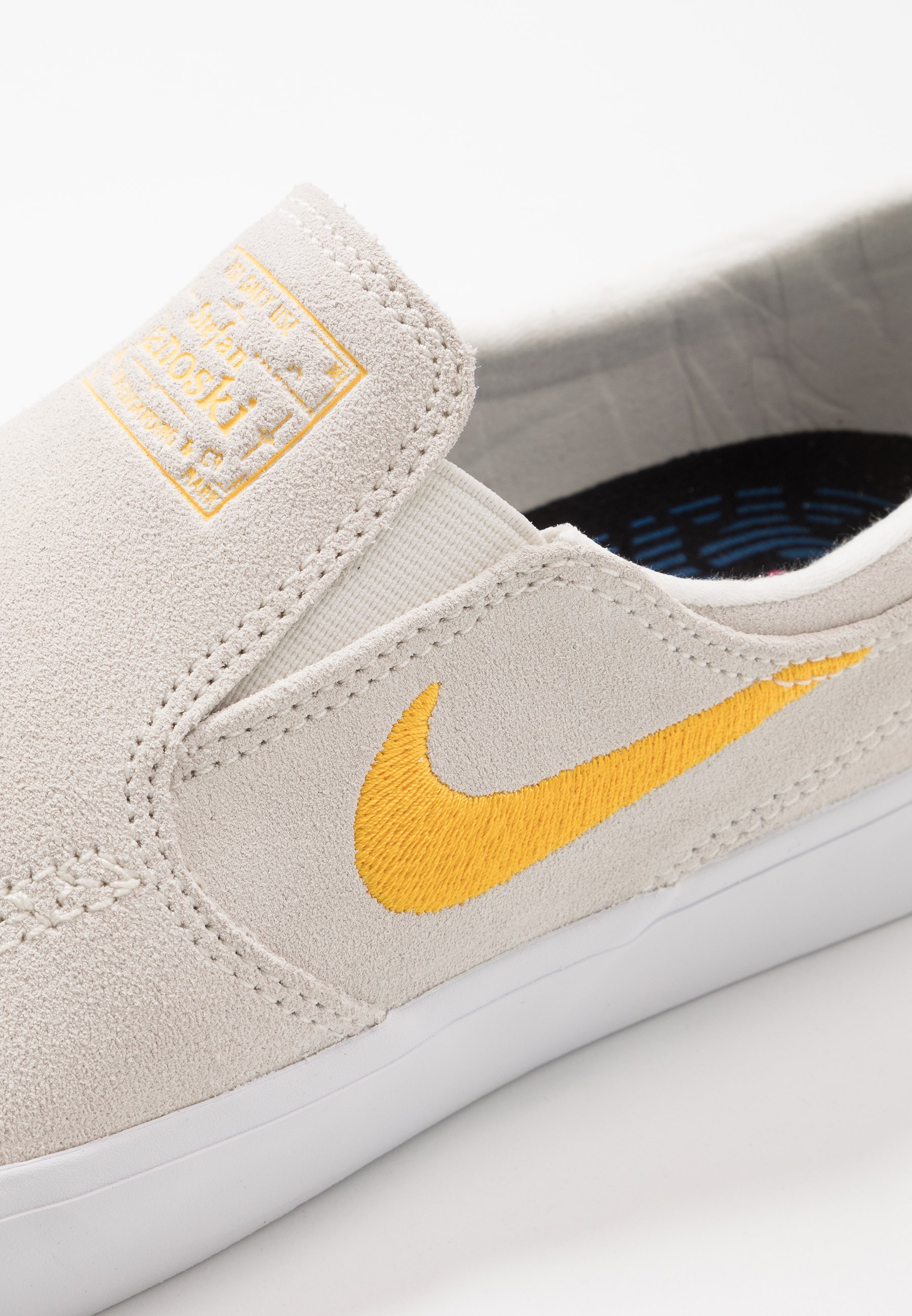 white nike sb slip ons
