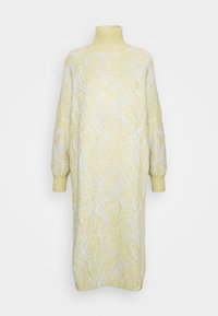 Långärmad, polokragsklänning i pastellgult med ett vågigt silvermönster. Mjuk textur, avslappnad passform och ribbade muddar.