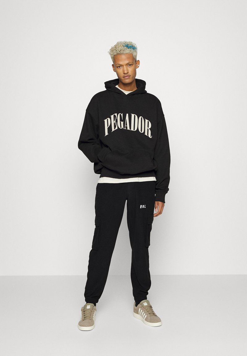 Redefined Rebel ARCHER PANTS UNISEX  - Calças de fato de treino - black