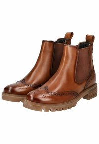 Braune Leder-Stiefeletten mit seitlichen elastischen Einsätzen, Broguemuster an der Spitze, strukturiertem Boden und Zuglaschen an der Rückseite.