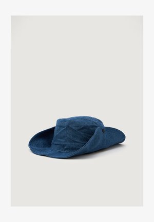 Blue denim bucket hat with a wide brim, round crown, and a textured finish. Features a side button for style and adjustment.
