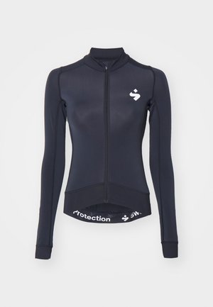 Marineblå cykeltrøje med lange ærmer og fuld frontlynlås, krave og hvidt logo. Har elastisk talje med trykt tekst i kanten.