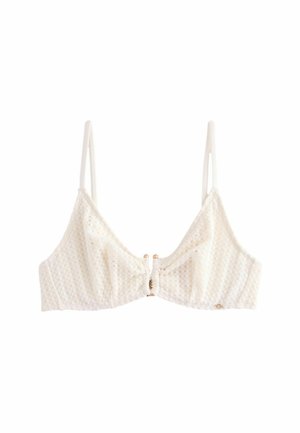 Reggiseno triangolare bianco e tessurizzato con spalline sottili regolabili e un gancio centrale con finiture in legno. Design semplice con dettagli sottili.