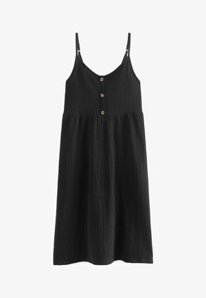 Robe midi noire sans manches avec bretelles spaghetti ajustables et trois boutons sur le devant en tissu texturé.