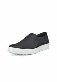 Scarpa nera in pelle senza lacci con finitura testurizzata, pannelli laterali elastici e suola in gomma bianca con scanalature orizzontali.