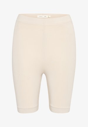 Pantaloni scurți de bicicletă bej, elastici, cu o textură netedă, talie medie și lungime până la genunchi. Fără cusături sau modele vizibile.