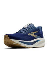 Zapatilla de running Brooks en azul y beige con suela blanca y azul, diseño de cordones y parte superior de malla transpirable, mostrada en una vista frontal en ángulo.