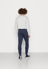Tommy Jeans SLIM PANT - Verryttelyhousut - twilight navy