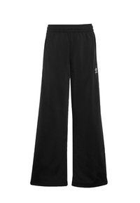 Pantalons larges noirs en tissu doux, dotés d'une taille élastique et d'un petit logo blanc sur le côté gauche.