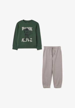 Grüner Sweatshirt mit einem rockigen Grafikdesign und grauen Jogginghosen mit elastischem Bund. Weiches Material mit gerippten Bündchen. Lockere Passform.