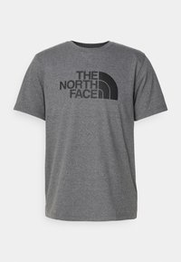 Gray cotton t-shirt with short sleeves, round neckline, featuring a large black logo of "THE NORTH FACE" and a half-arch design.