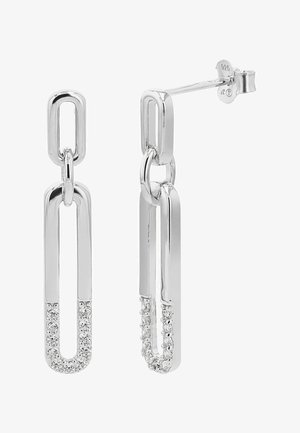 Dwa srebrne kolczyki wiszące z połączonymi wydłużonymi owalnymi kształtami, dolny owal częściowo ozdobiony małymi, przezroczystymi kryształami.