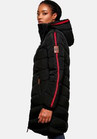 Padded black long coat with red stripes on sleeves, zippered pockets, and a drawstring hood; features a textured quilted pattern.