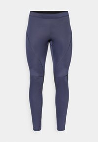 Leggings deportivos en color azul marino confeccionados con tejido elástico, que cuentan con una cinturilla alta, paneles laterales negros y detalles de costura curva.