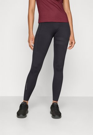 Sorte, tettsittende atletisk leggings med en jevn tekstur, med en sidelomme og horisontale striper på den øvre låret.