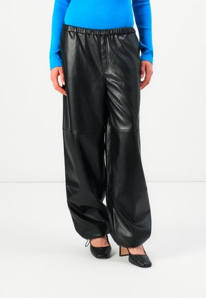 HUTENI - Trousers - black