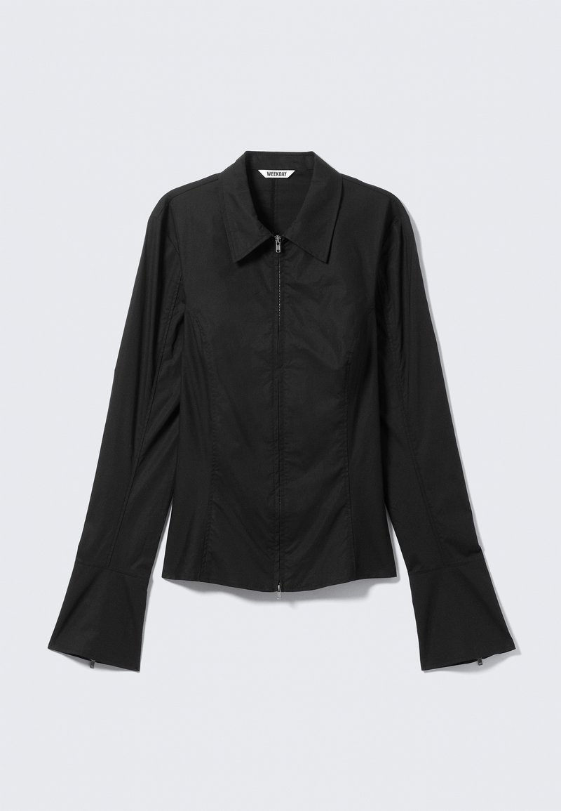 Black zip-up jacket with a pointed collar, long sleeves, and flared cuffs. Made of a smooth, lightweight material.