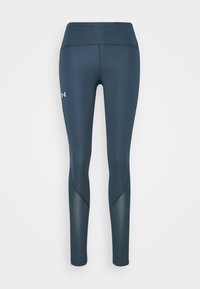 Granatowe legginsy sportowe z wysokim stanem, gładką teksturą i charakterystycznym logo na lewym udzie; zaprojektowane dla komfortu i elastyczności.