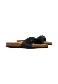 Sorte slidesandaler med en bred rem og justerbar spænde. Korkfodbede og gummisål giver polstring og støtte.