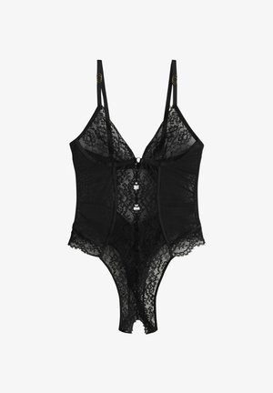 Zwarte kanten body met verstelbare bandjes, een sweetheart-halslijn en een knoopdetail aan de voorkant. Transparante kant met geschulpte randen.