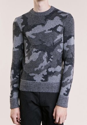 Gray camouflage sweater made of knit fabric. Features a crew neck, ribbed cuffs and hem, textured pattern with varying shades of gray.