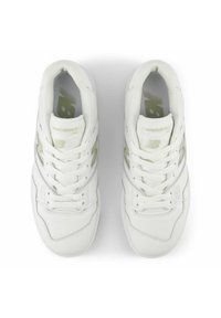 White leather sneakers with green accents, rounded toe, and lace-up closure. Features perforated detailing and a logo on the tongue.