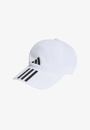Gorra blanca de tela con visera curva. Logo de Adidas en negro y tres franjas adornan el panel frontal. Cierre trasero ajustable.