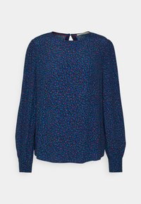 Blusa lunga a maniche con un motivo testurizzato che presenta tonalità di blu, rosso e verde. Dettaglio con apertura a chiave sulla schiena e vestibilità comoda.