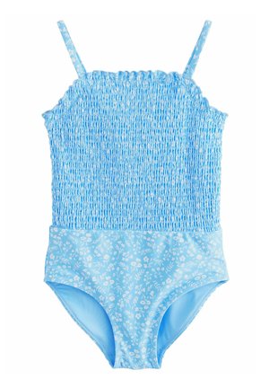 Maillot de bain une pièce bleu clair avec corsage froncé et bas ainsi que bretelles à motif floral sur fond blanc.