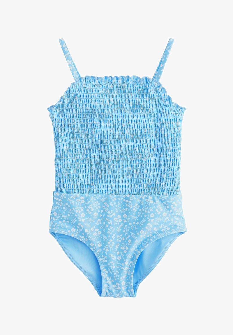Maillot de bain une pièce bleu clair avec corsage froncé et bas ainsi que bretelles à motif floral sur fond blanc.