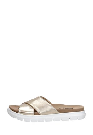 Sandale à enfiler avec des lanières croisées métalliques dorées et une semelle épaisse en caoutchouc blanc, conçue pour un usage décontracté.
