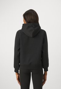 Athleta COZY KARMA HOODIE  - Sweat à capuche - black