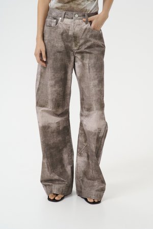 Wide-leg pants in a textured, mottled grey fabric. Features include a high waist, front pockets, and subtle stitching details.