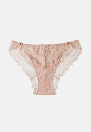 Beige lace panties with floral patterns and mesh sides, featuring scalloped edges and small decorative rings near the waistband.