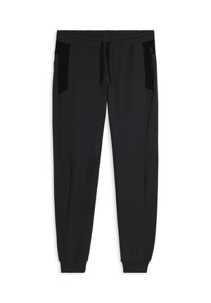 Pantalons de jogging noirs en tissu doux, avec des poches latérales avec des panneaux noirs, une taille élastique et des poignets côtelés.