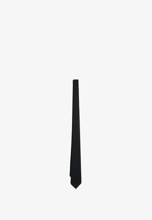 Corbata azul marino oscuro con un sutil patrón repetitivo de pequeños puntos verdes distribuidos uniformemente por toda la tela.